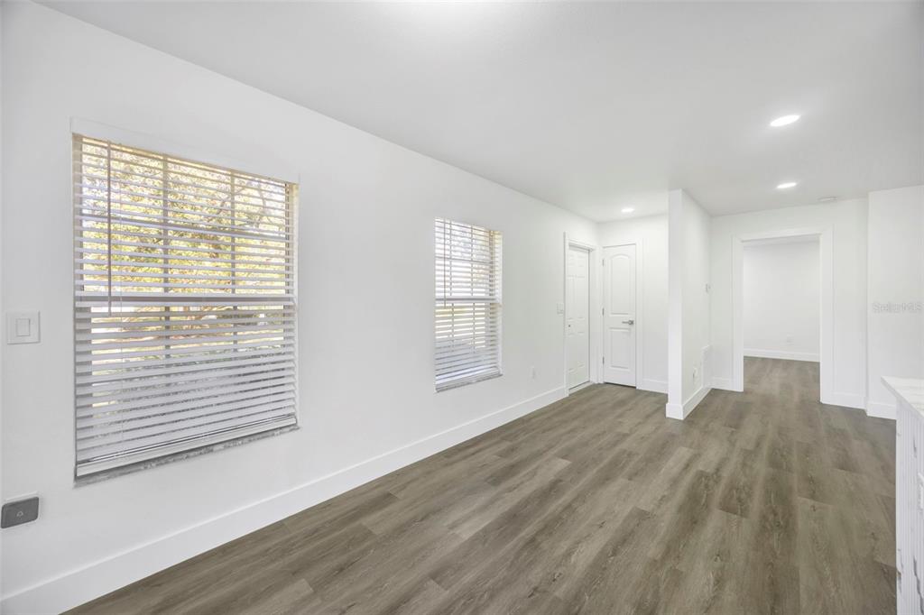 11728 Raintree Drive Temple Terrace, FL 33617 - Photo 3 of 41 a view of empty room with wooden floor and fan