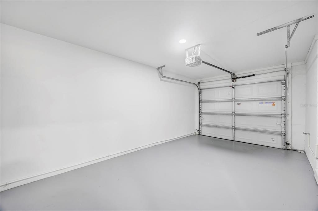 11728 Raintree Drive Temple Terrace, FL 33617 - Photo 33 of 41 a view of a room with closet and racks on the wall