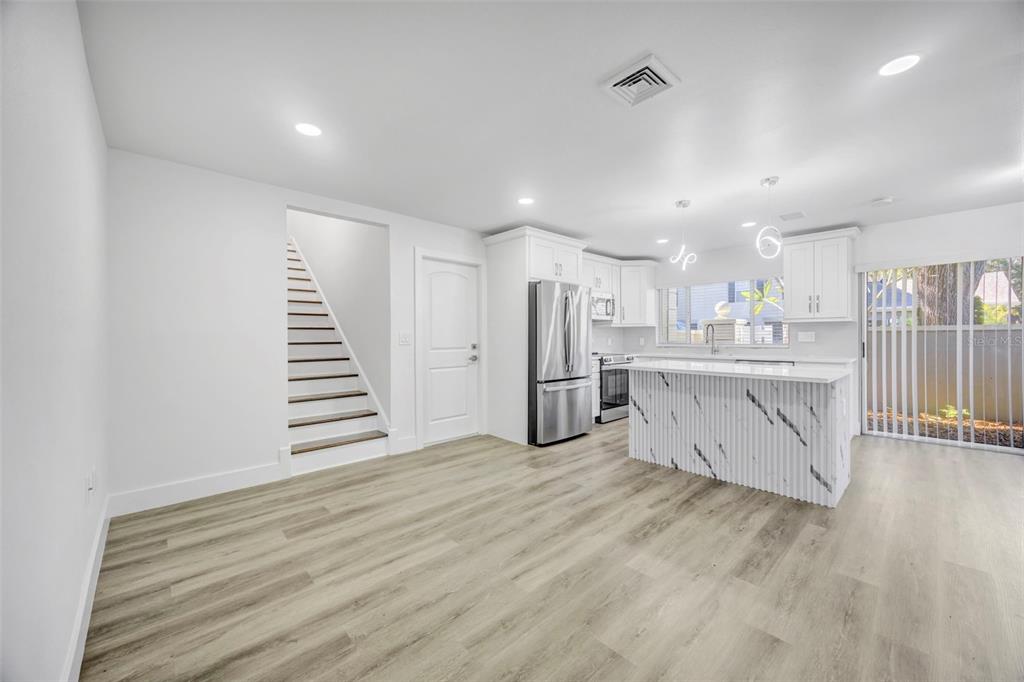 11728 Raintree Drive Temple Terrace, FL 33617 - Photo 9 of 41 a view of kitchen with wooden floor and electronic appliances