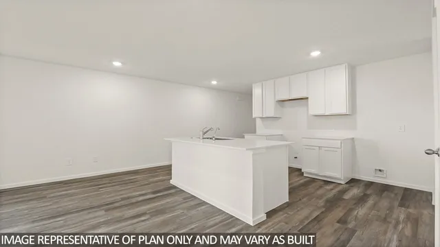 a utility room with a sink washer and dryer