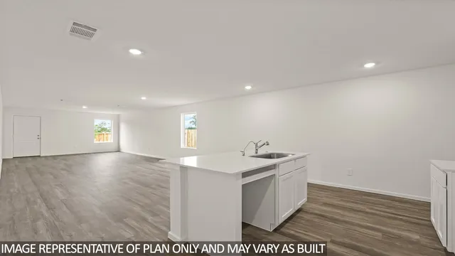 a view of a kitchen counter space and a sink