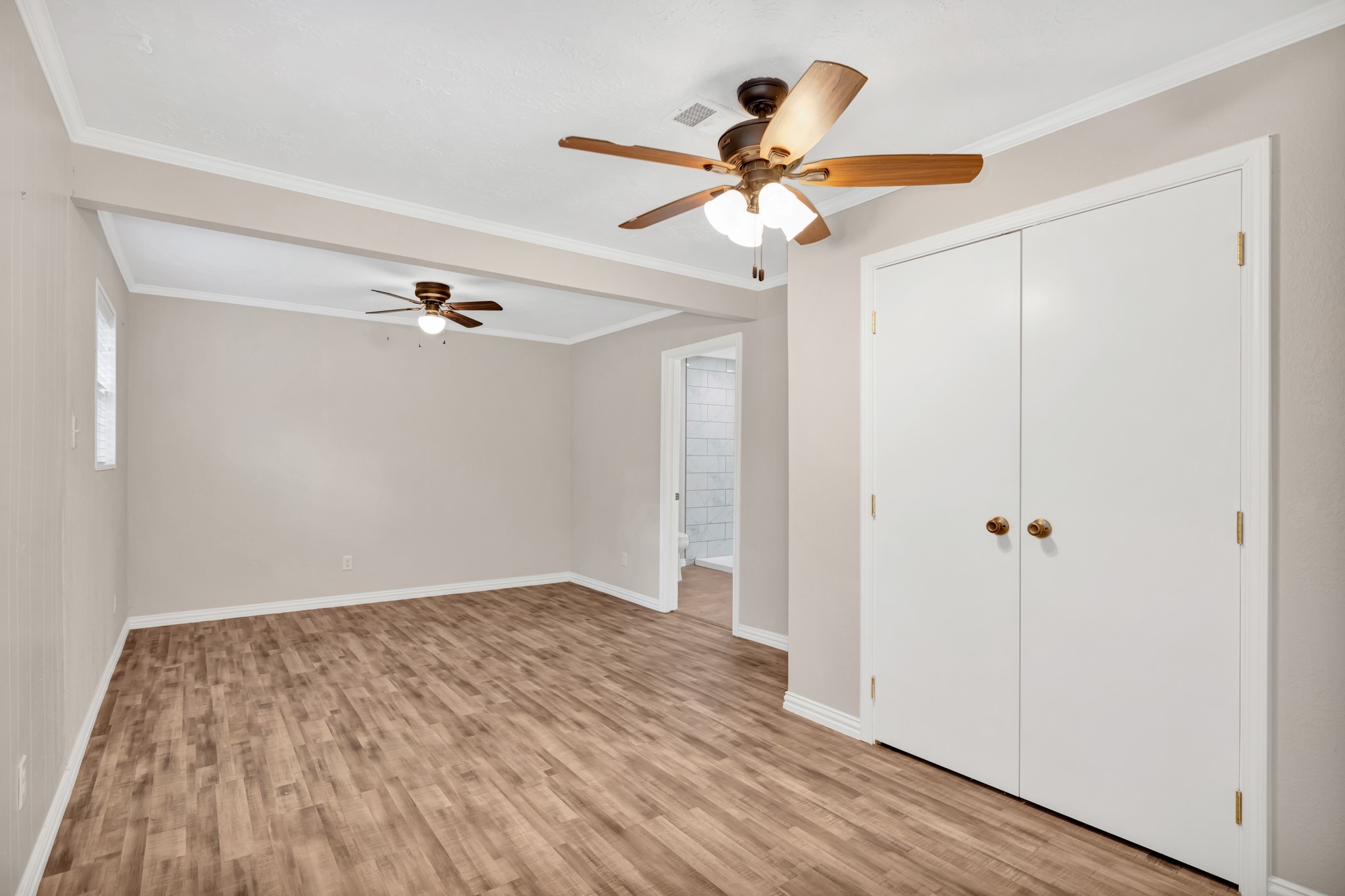 10863 Autumn Lane Cleveland, TX 77328 - Photo 12 of 24 a view of empty room with wooden floor