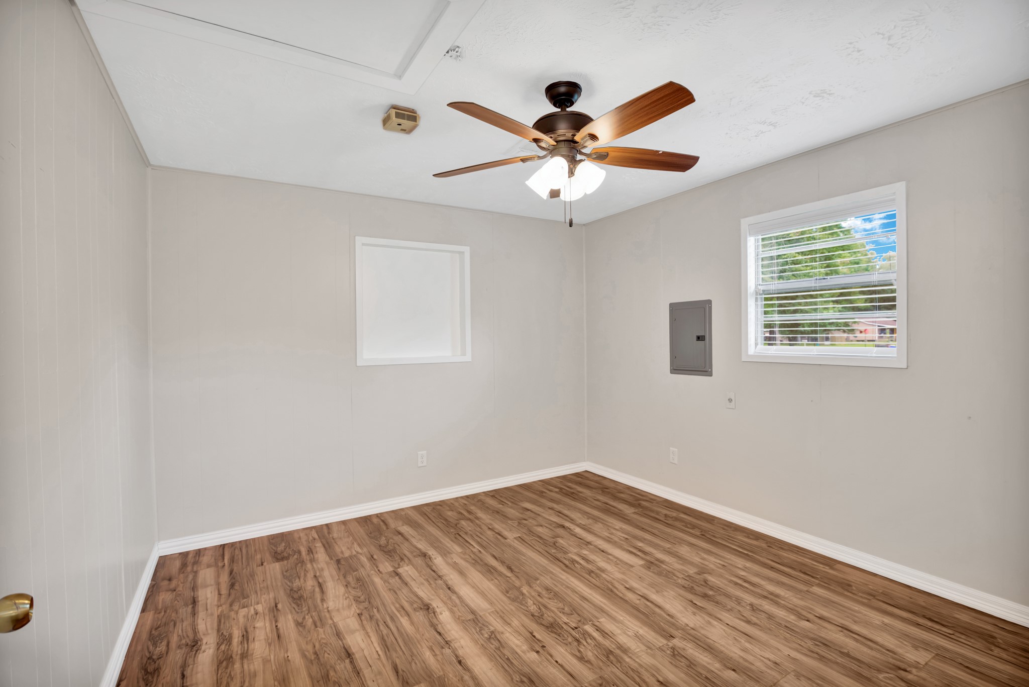 10863 Autumn Lane Cleveland, TX 77328 - Photo 18 of 24 a view of empty room with wooden floor and fan