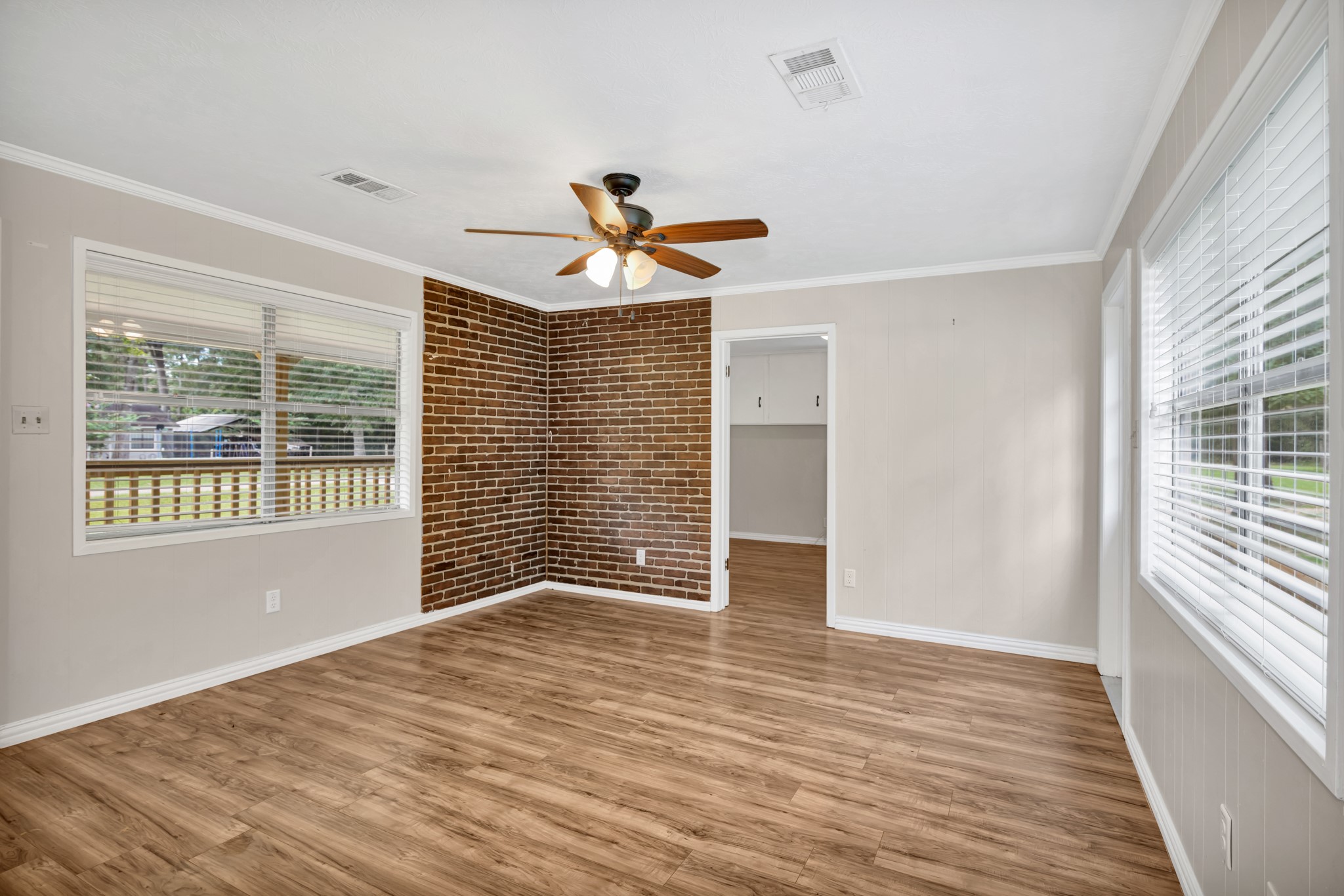 10863 Autumn Lane Cleveland, TX 77328 - Photo 3 of 24 a view of a livingroom with a window and wooden floor