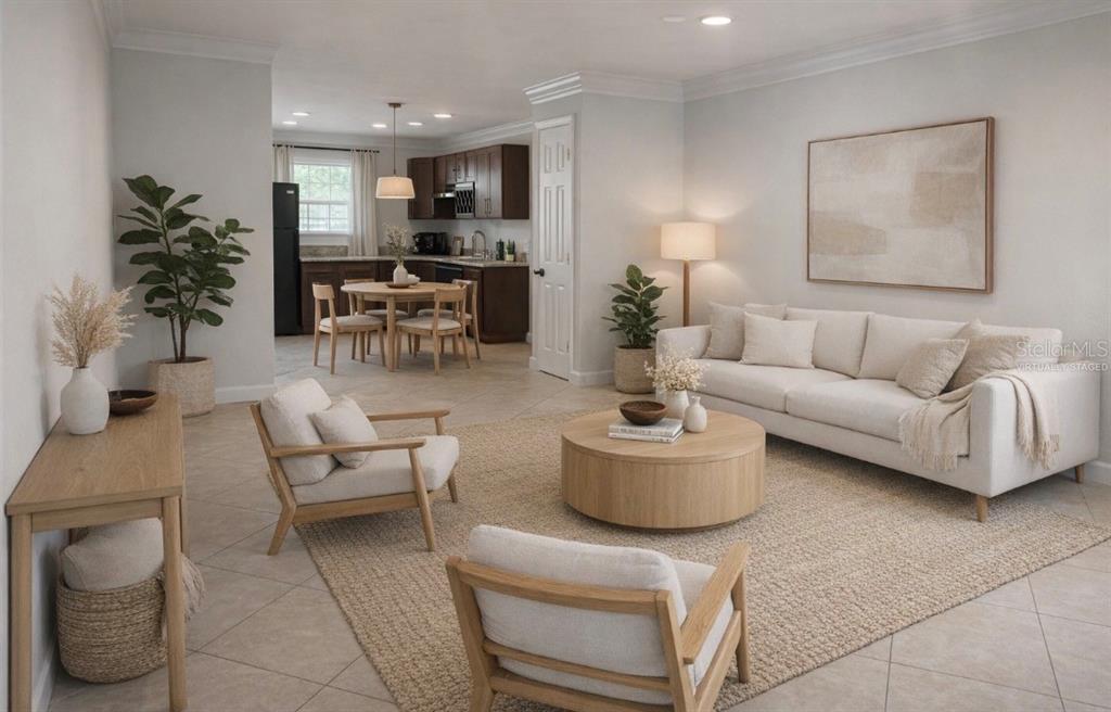2500 Lee Road, Unit 202 Winter Park, FL 32789 - Photo 25 of 52 a living room with furniture and a potted plant