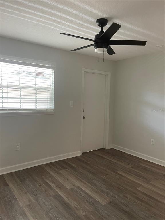 2500 Lee Road, Unit 202 Winter Park, FL 32789 - Photo 25 of 39 an empty room with wooden floor fan and windows