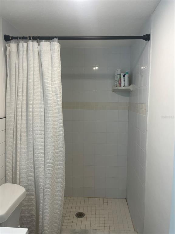 2500 Lee Road, Unit 202 Winter Park, FL 32789 - Photo 30 of 39 a bathroom with a shower and a toilet