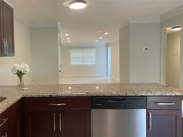 a kitchen with a sink and a stove top oven