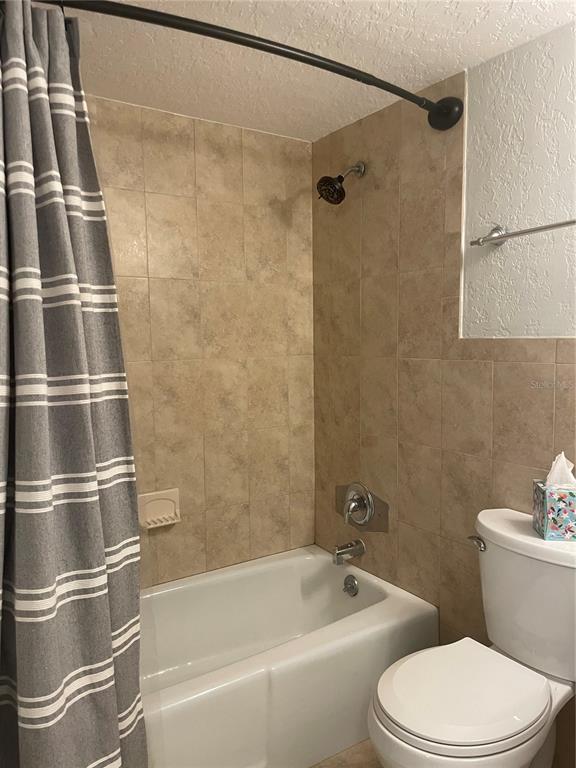 2500 Lee Road, Unit 202 Winter Park, FL 32789 - Photo 36 of 39 a bathroom with a bathtub and a shower