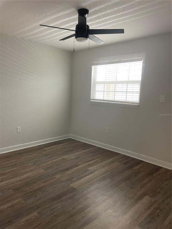 2500 Lee Road, Unit 202 Winter Park, FL 32789 - Photo 38 of 52 a view of an empty room with wooden floor closet and a window