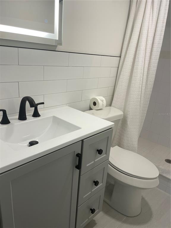 2500 Lee Road, Unit 202 Winter Park, FL 32789 - Photo 41 of 52 a bathroom with a sink a toilet and shower