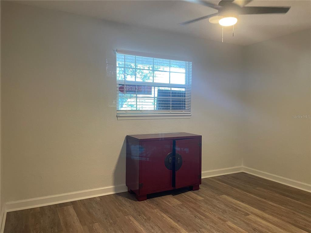 2500 Lee Road, Unit 202 Winter Park, FL 32789 - Photo 44 of 52 an empty room with wooden floor and windows