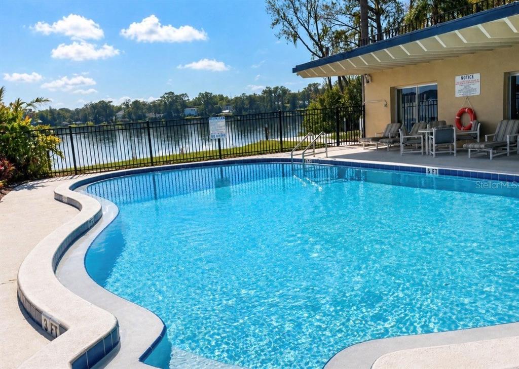 2500 Lee Road, Unit 202 Winter Park, FL 32789 - Photo 9 of 52 a view of a swimming pool with a patio