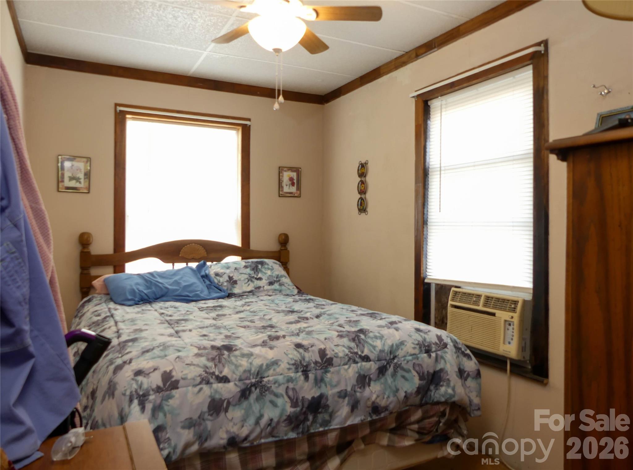 722 Union Hill Ridge Road Green Mountain, NC 28740 - Photo 13 of 21 a bedroom with a bed and a window