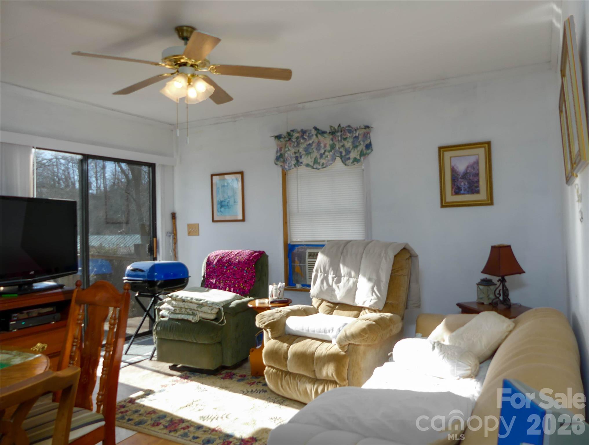722 Union Hill Ridge Road Green Mountain, NC 28740 - Photo 14 of 21 a living room with furniture and a flat screen tv