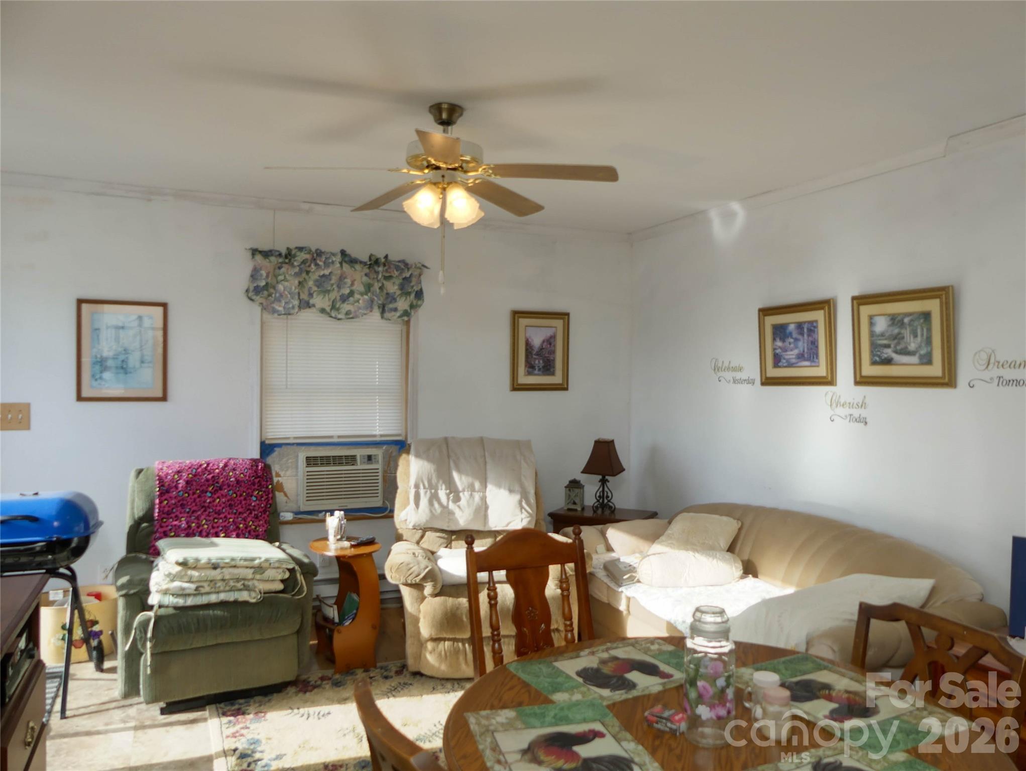 722 Union Hill Ridge Road Green Mountain, NC 28740 - Photo 15 of 21 a living room with furniture a rug and a chandelier