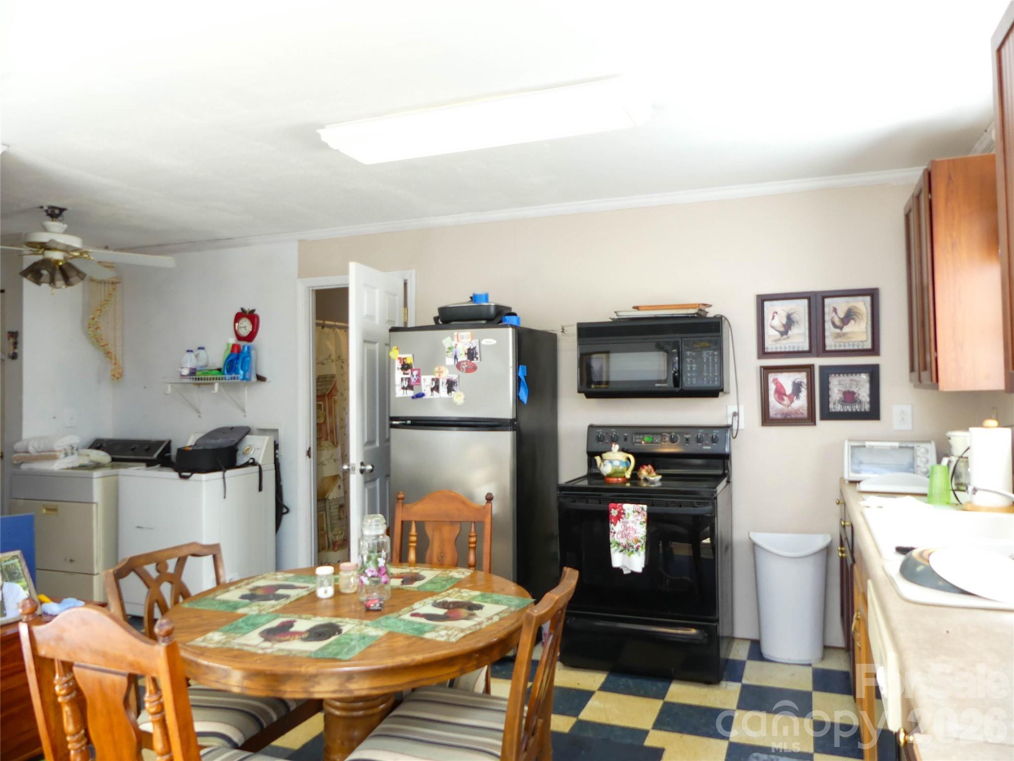 722 Union Hill Ridge Road Green Mountain, NC 28740 - Photo 19 of 21 a view of a dining room with furniture and a kitchen