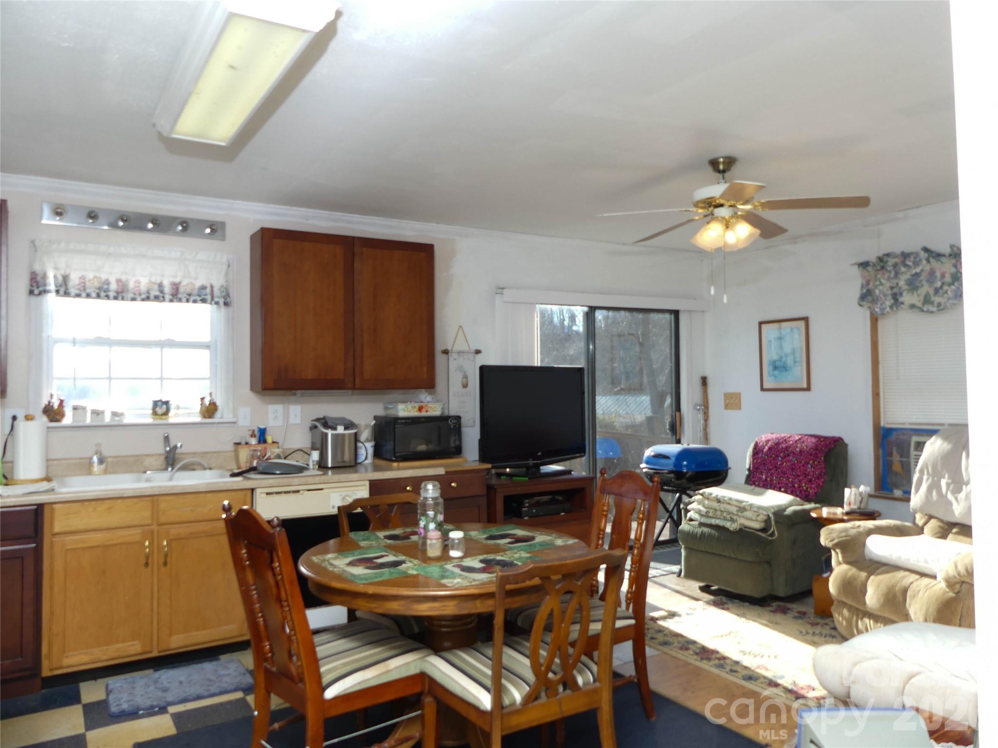 722 Union Hill Ridge Road Green Mountain, NC 28740 - Photo 20 of 21 a view of a dining room with furniture and a window