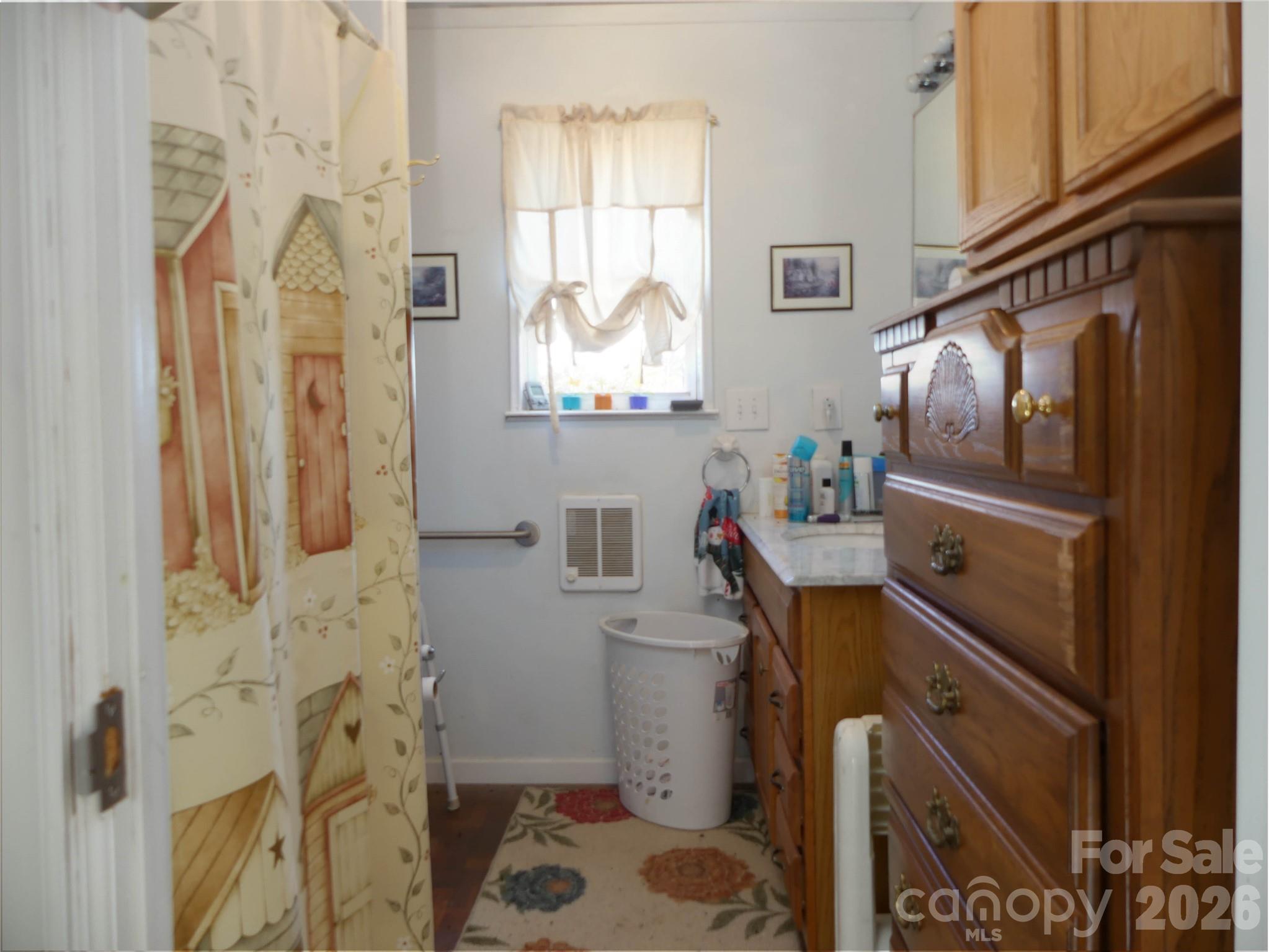 722 Union Hill Ridge Road Green Mountain, NC 28740 - Photo 21 of 21 a bathroom with a sink toilet and shower