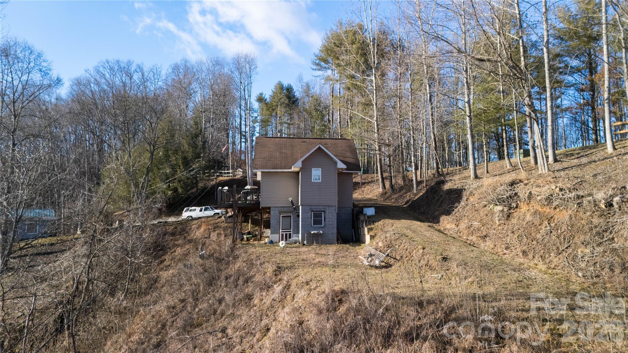 722 Union Hill Ridge Road Green Mountain, NC 28740 - Photo 9 of 21 a view of a house with a bed and chair