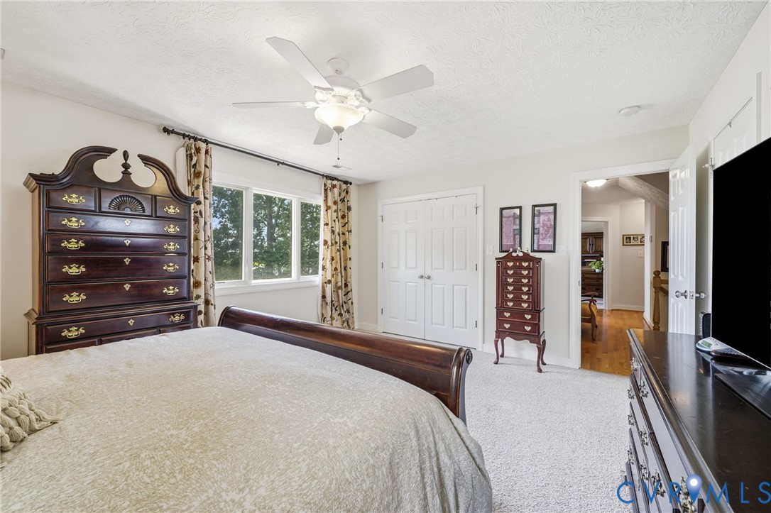210 Riverview Road Stevensville, VA 23161 - Photo 30 of 63 Carpeted room featuring a ceiling fan with integra