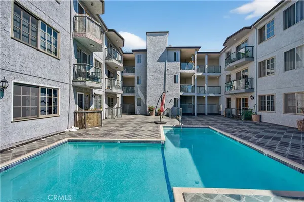a view of a street with a building in the background