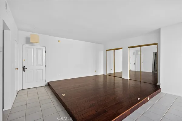 an empty room with wooden floor