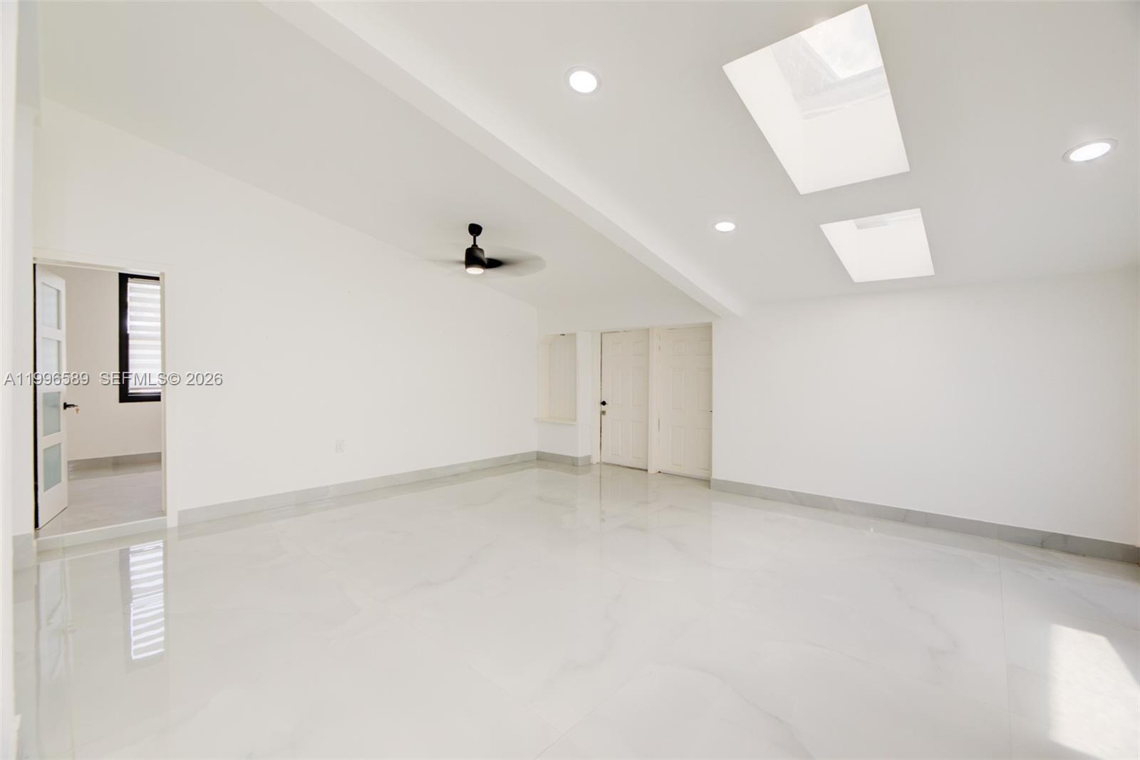 17101 Southwest 48th Street Southwest Ranches, FL 33331 - Photo 16 of 31 an empty room with entrance and mirror