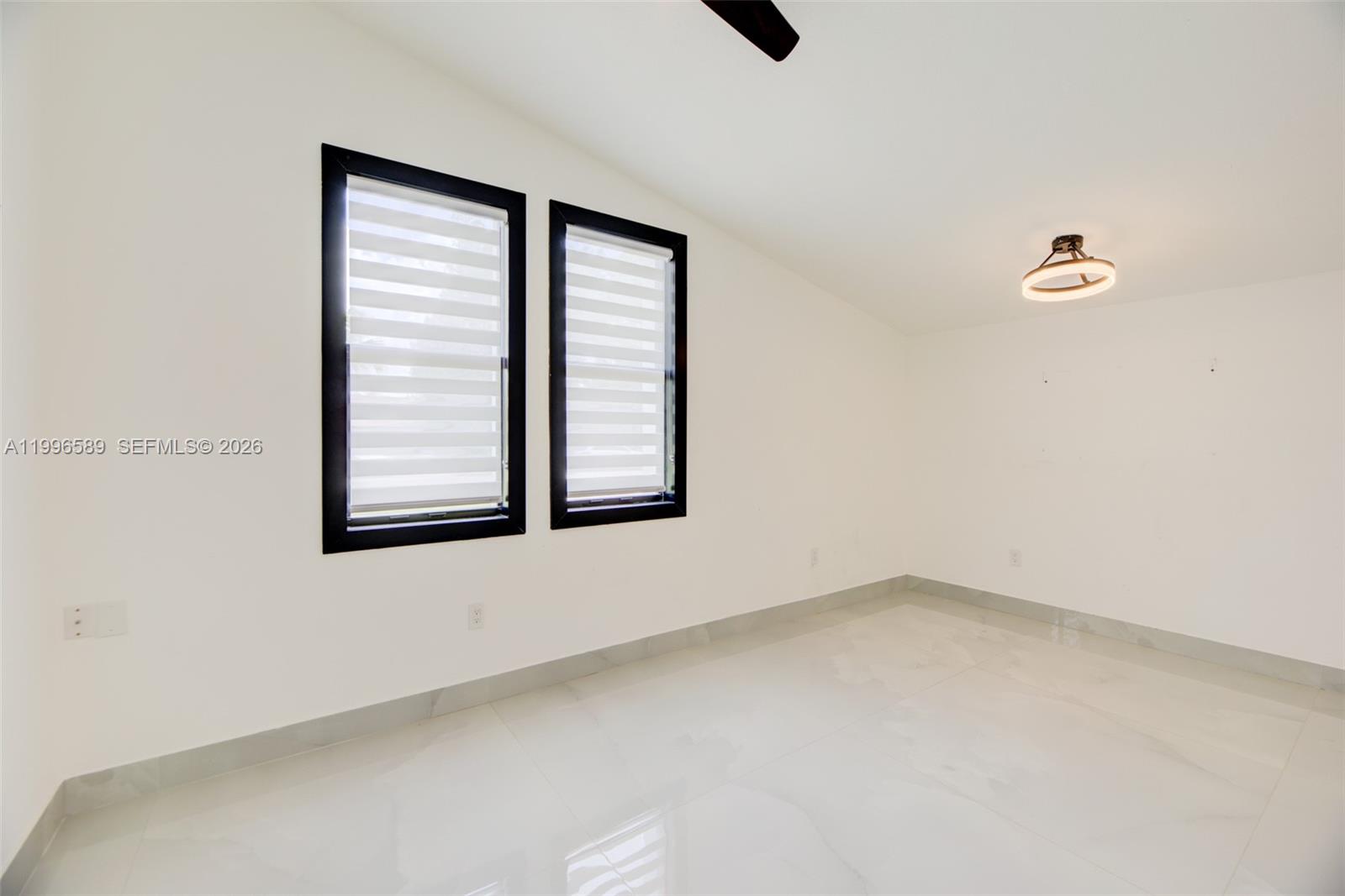 17101 Southwest 48th Street Southwest Ranches, FL 33331 - Photo 17 of 31 an empty room with windows