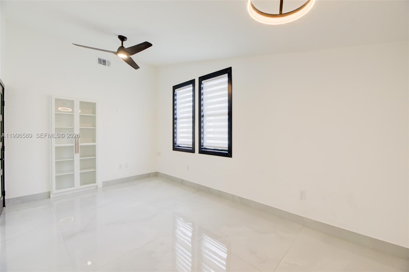 17101 Southwest 48th Street Southwest Ranches, FL 33331 - Photo 19 of 31 a view of an empty room with a window