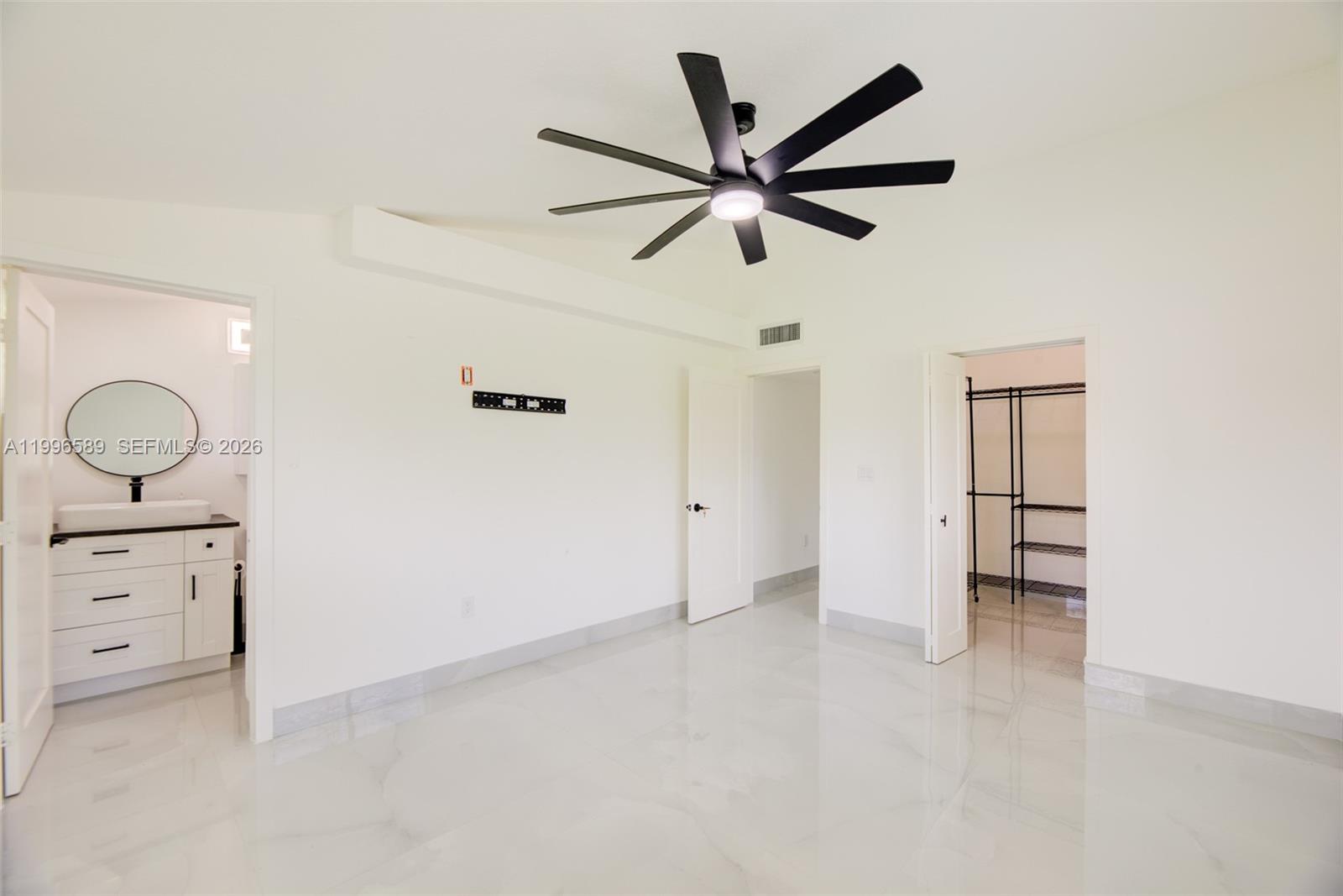 17101 Southwest 48th Street Southwest Ranches, FL 33331 - Photo 20 of 31 a view of a livingroom with a ceiling fan and window
