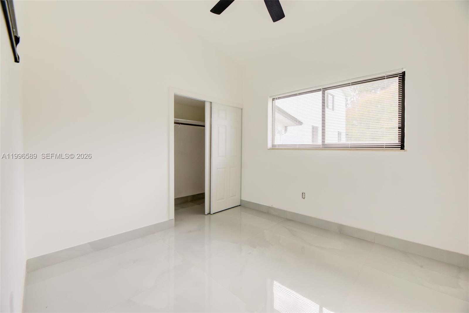 17101 Southwest 48th Street Southwest Ranches, FL 33331 - Photo 23 of 31 an empty room with windows