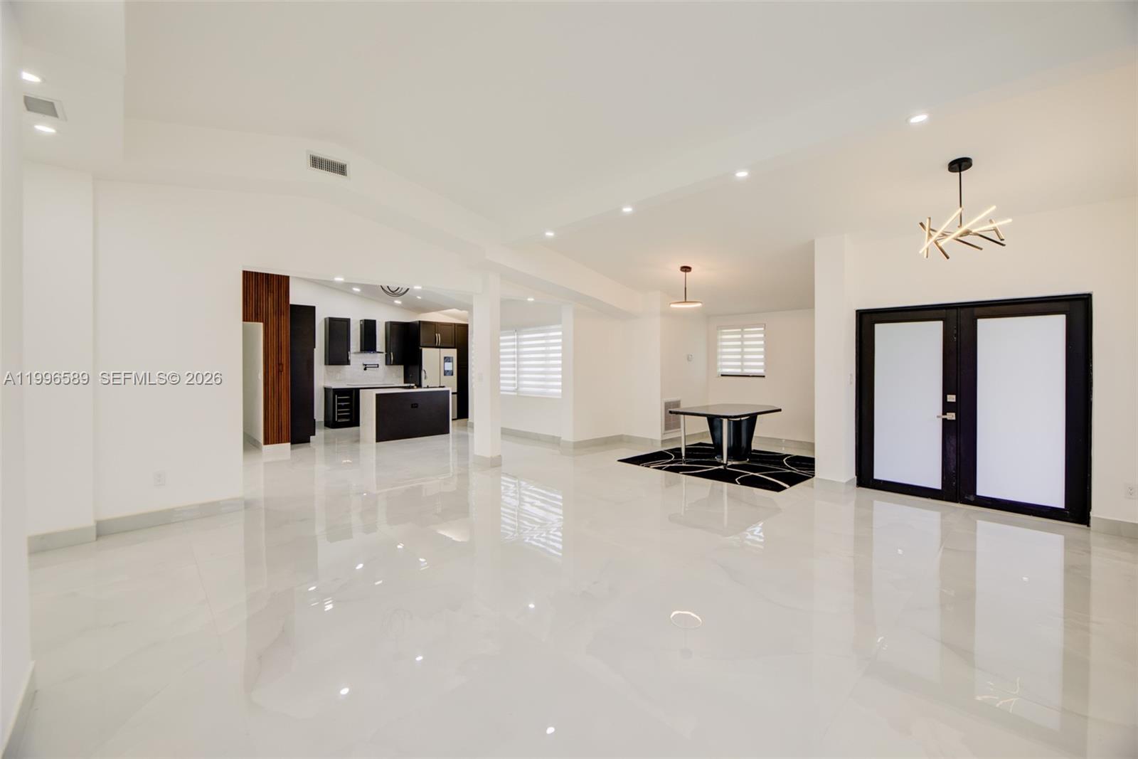 17101 Southwest 48th Street Southwest Ranches, FL 33331 - Photo 6 of 31 a view of kitchen and living room with furniture