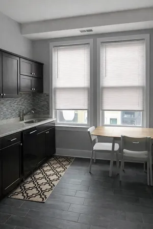 a kitchen with a sink and a window