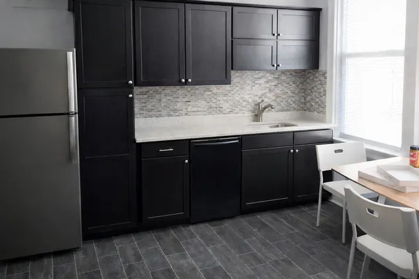 a kitchen with a sink and wooden cabinets