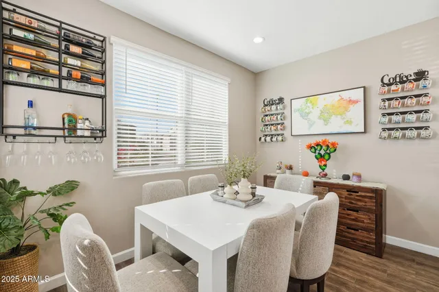a view of a dining room with furniture and window