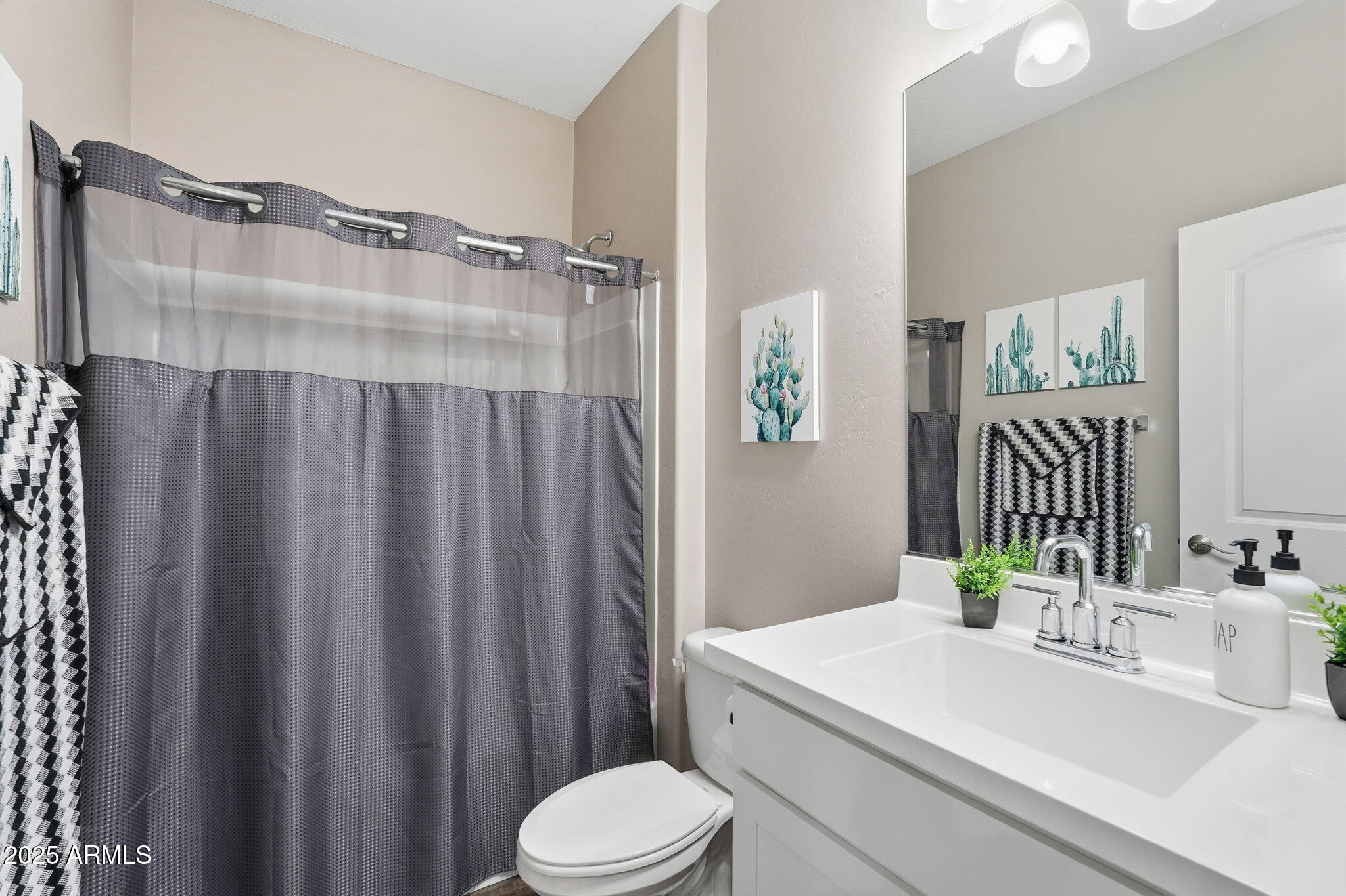 1255 North Arizona Avenue, Unit 1323 Chandler, AZ 85225 - Photo 19 of 30 a bathroom with a sink vanity mirror and toilet