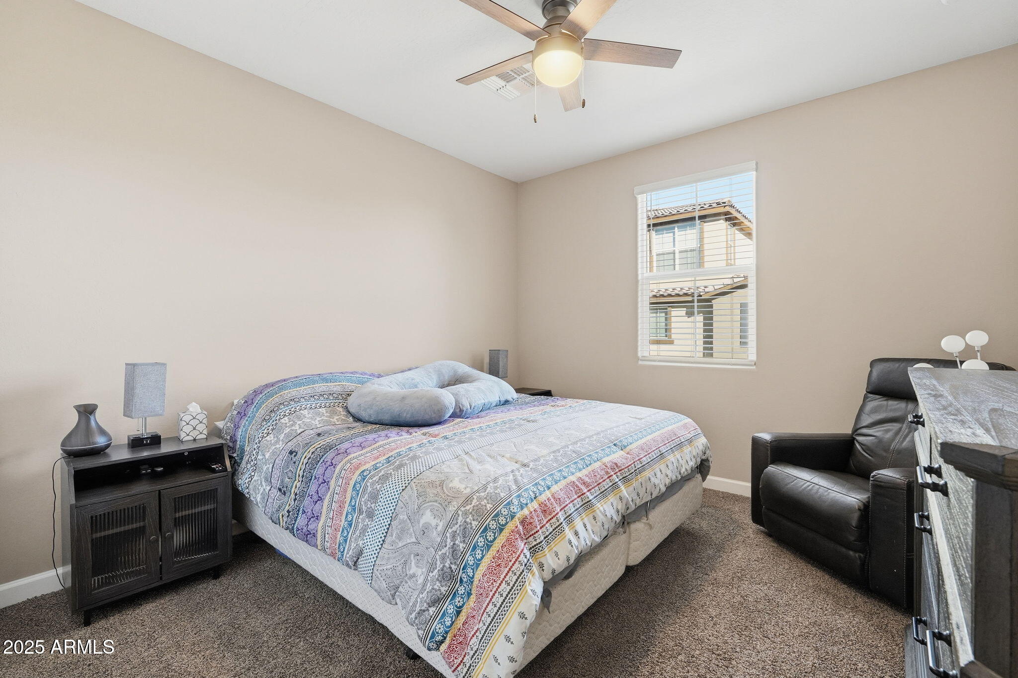 1255 North Arizona Avenue, Unit 1323 Chandler, AZ 85225 - Photo 20 of 30 a bedroom with a bed and wooden floor