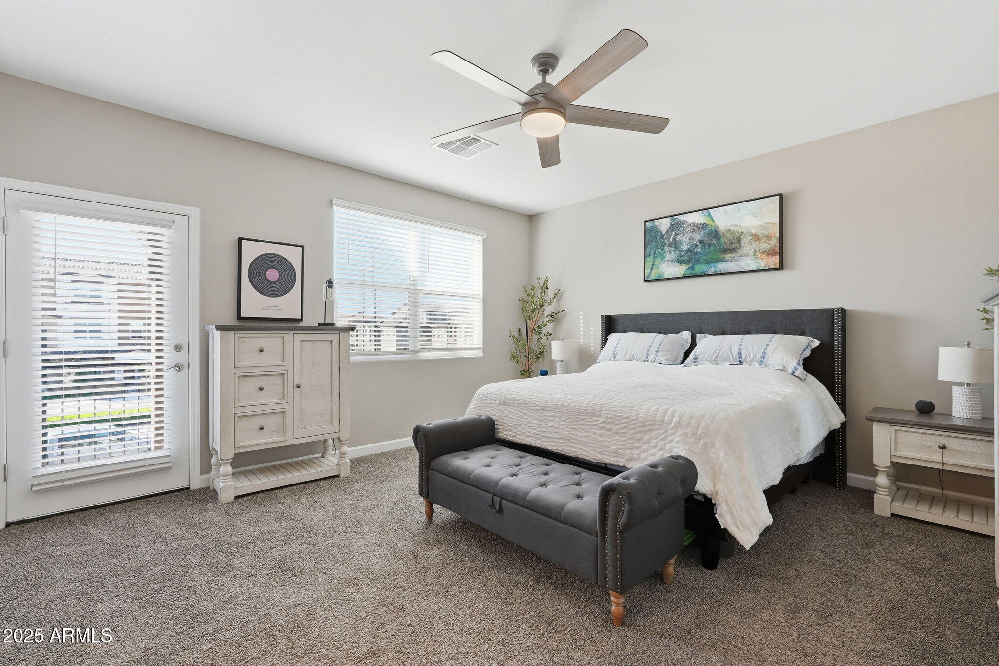 1255 North Arizona Avenue, Unit 1323 Chandler, AZ 85225 - Photo 21 of 30 a spacious bedroom with a bed a dresser and a window