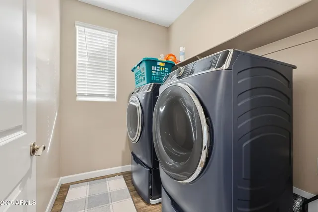a utility room with dryer and washer