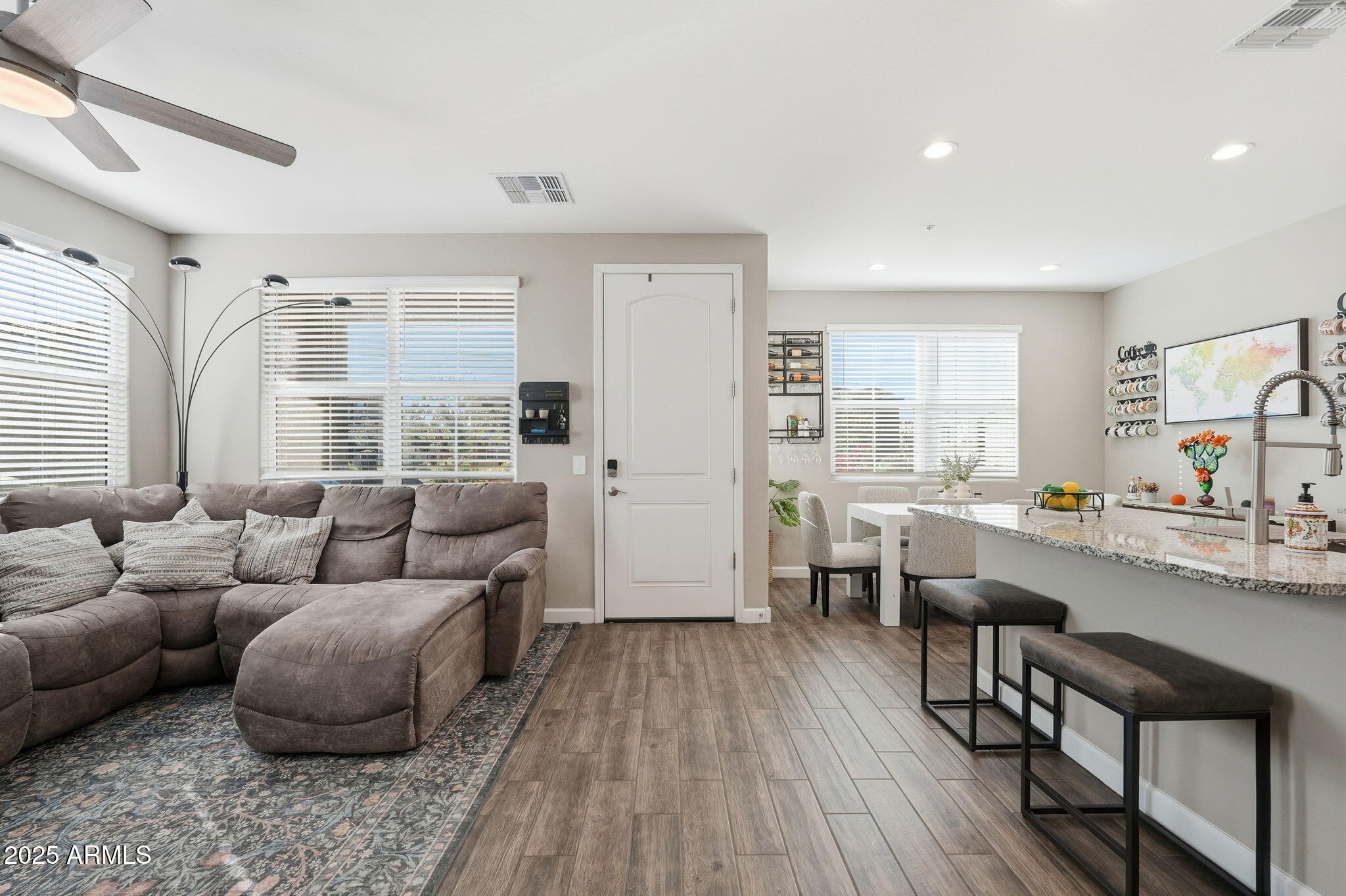 1255 North Arizona Avenue, Unit 1323 Chandler, AZ 85225 - Photo 5 of 30 a living room with furniture and wooden floor