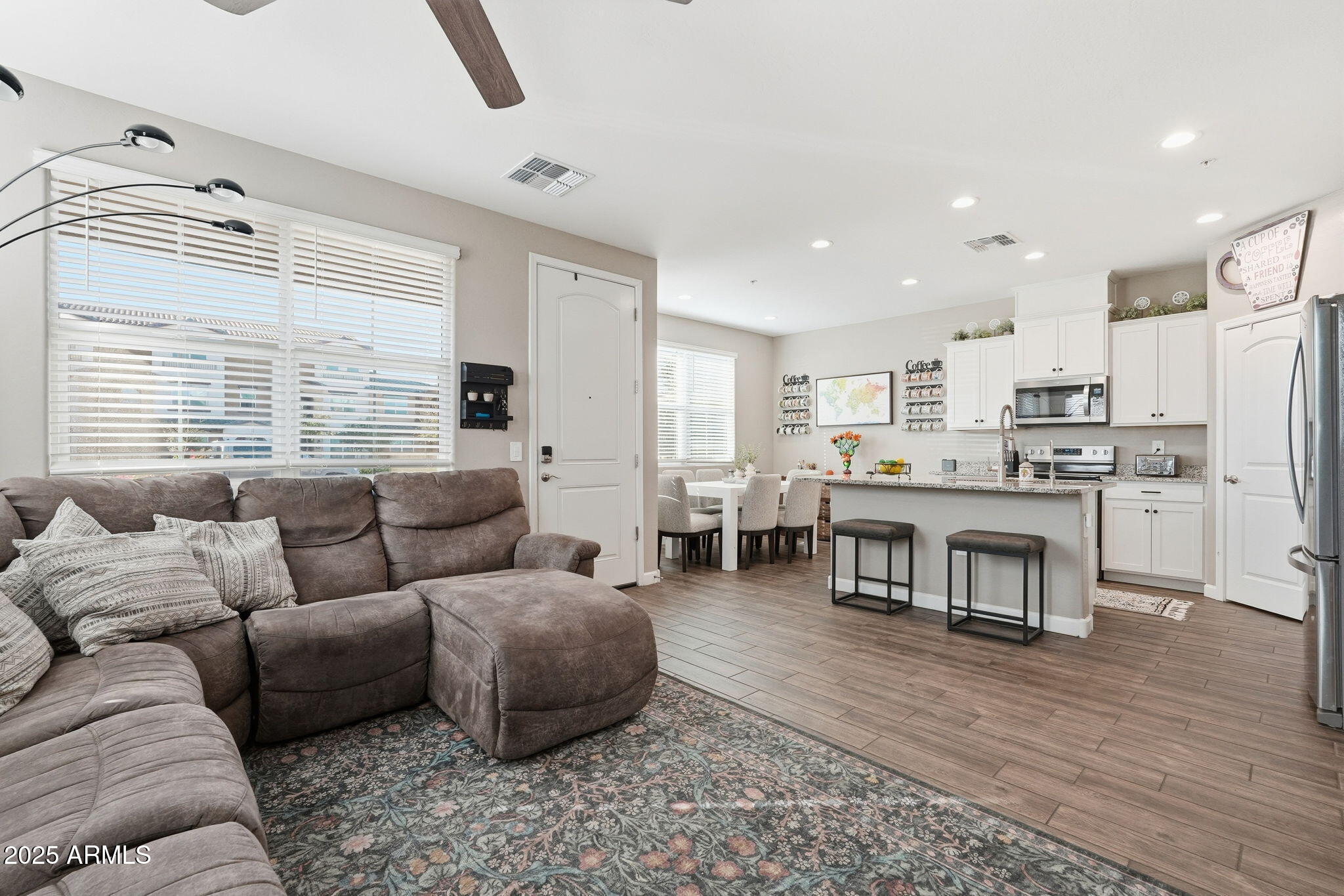 1255 North Arizona Avenue, Unit 1323 Chandler, AZ 85225 - Photo 7 of 30 a living room with furniture and a large window