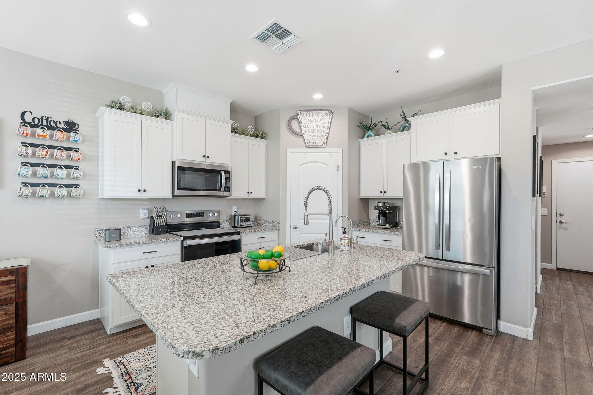 1255 North Arizona Avenue, Unit 1323 Chandler, AZ 85225 - Photo 10 of 30 a kitchen with stainless steel appliances granite countertop a sink refrigerator and microwave