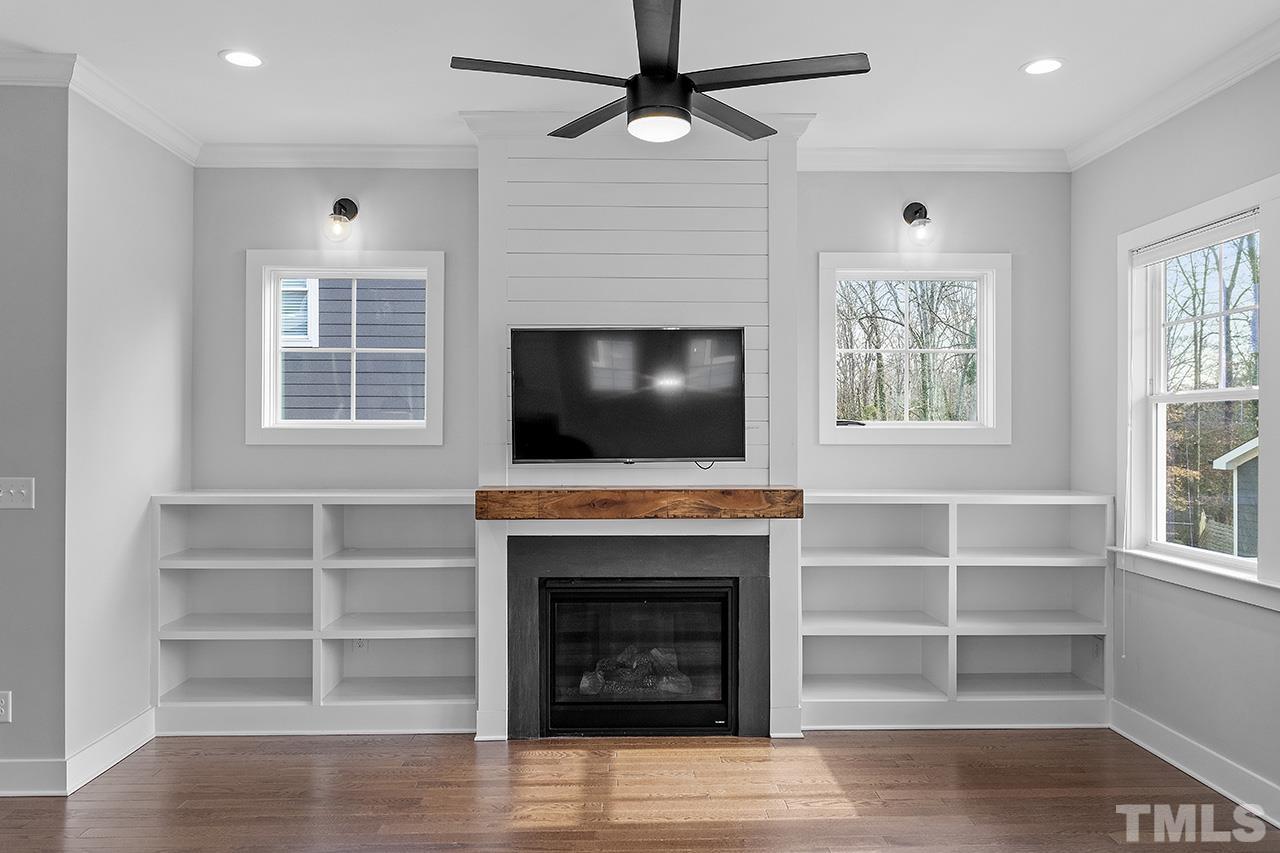 2320.5 Milburnie Road Raleigh, NC 27610 - Photo 11 of 32 a living room with furniture and a fireplace