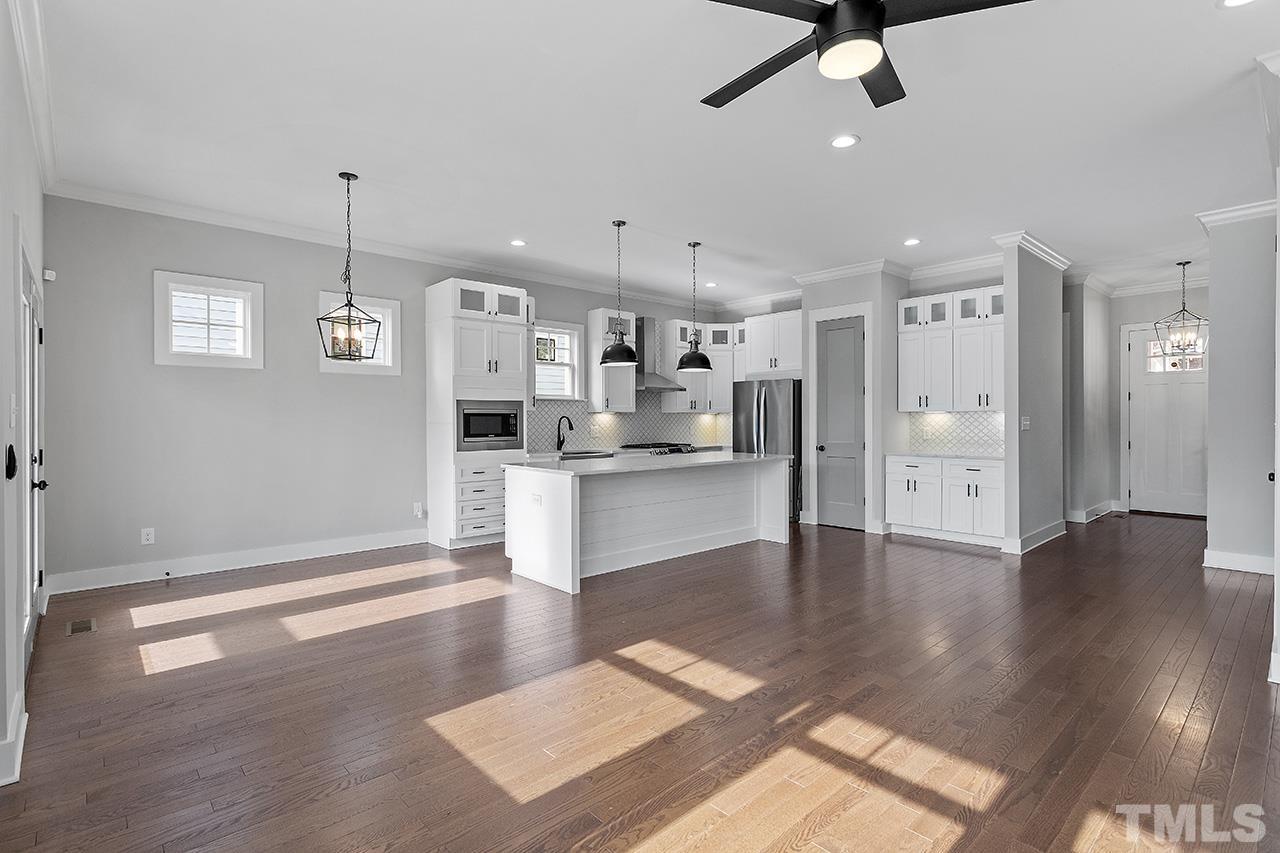 2320.5 Milburnie Road Raleigh, NC 27610 - Photo 12 of 32 a view of kitchen with cabinets and wooden floor