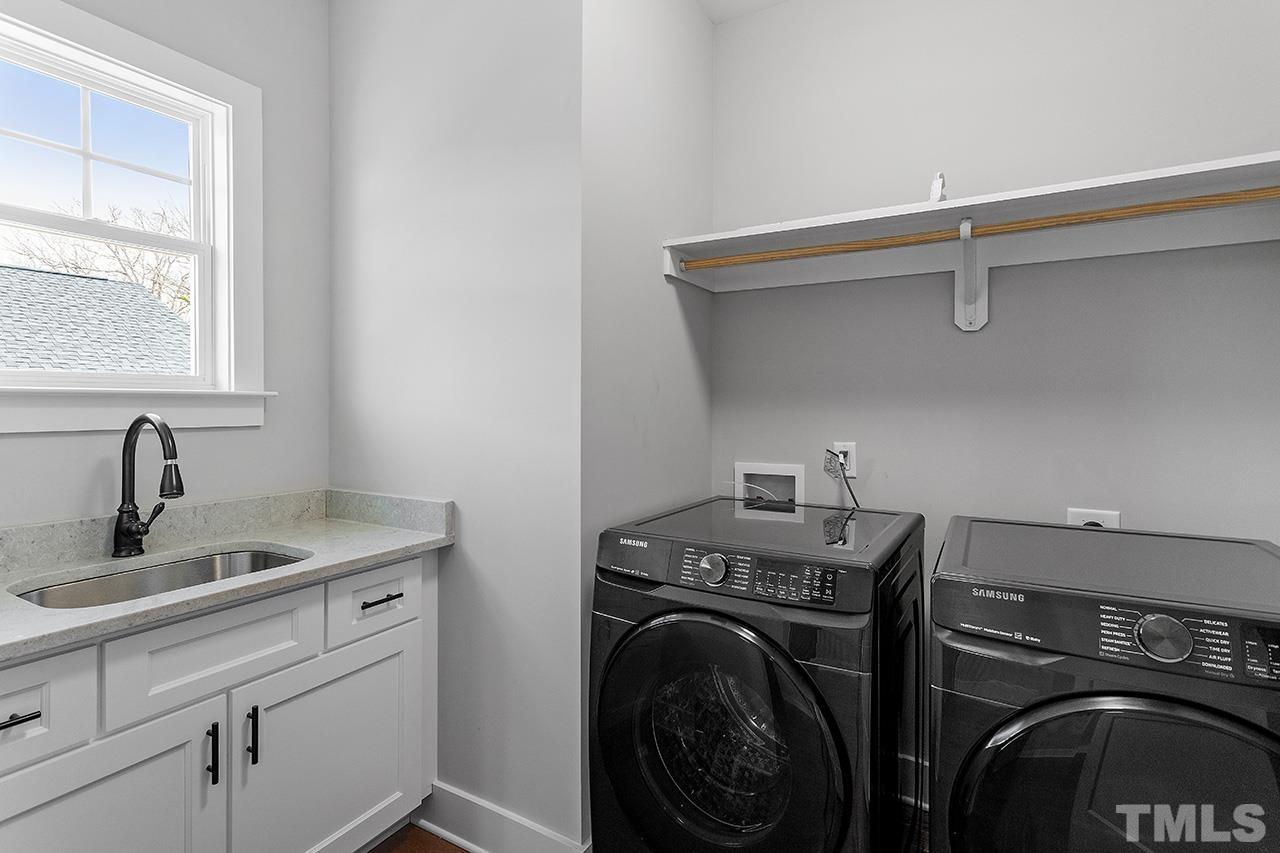 2320.5 Milburnie Road Raleigh, NC 27610 - Photo 23 of 32 a utility room with dryer and washer