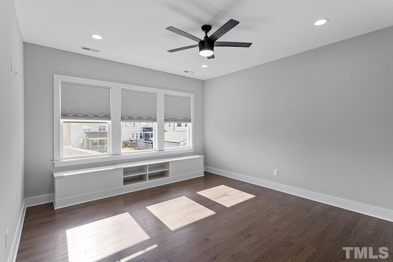 2320.5 Milburnie Road Raleigh, NC 27610 - Photo 24 of 32 a view of workspace with wooden floor and windows