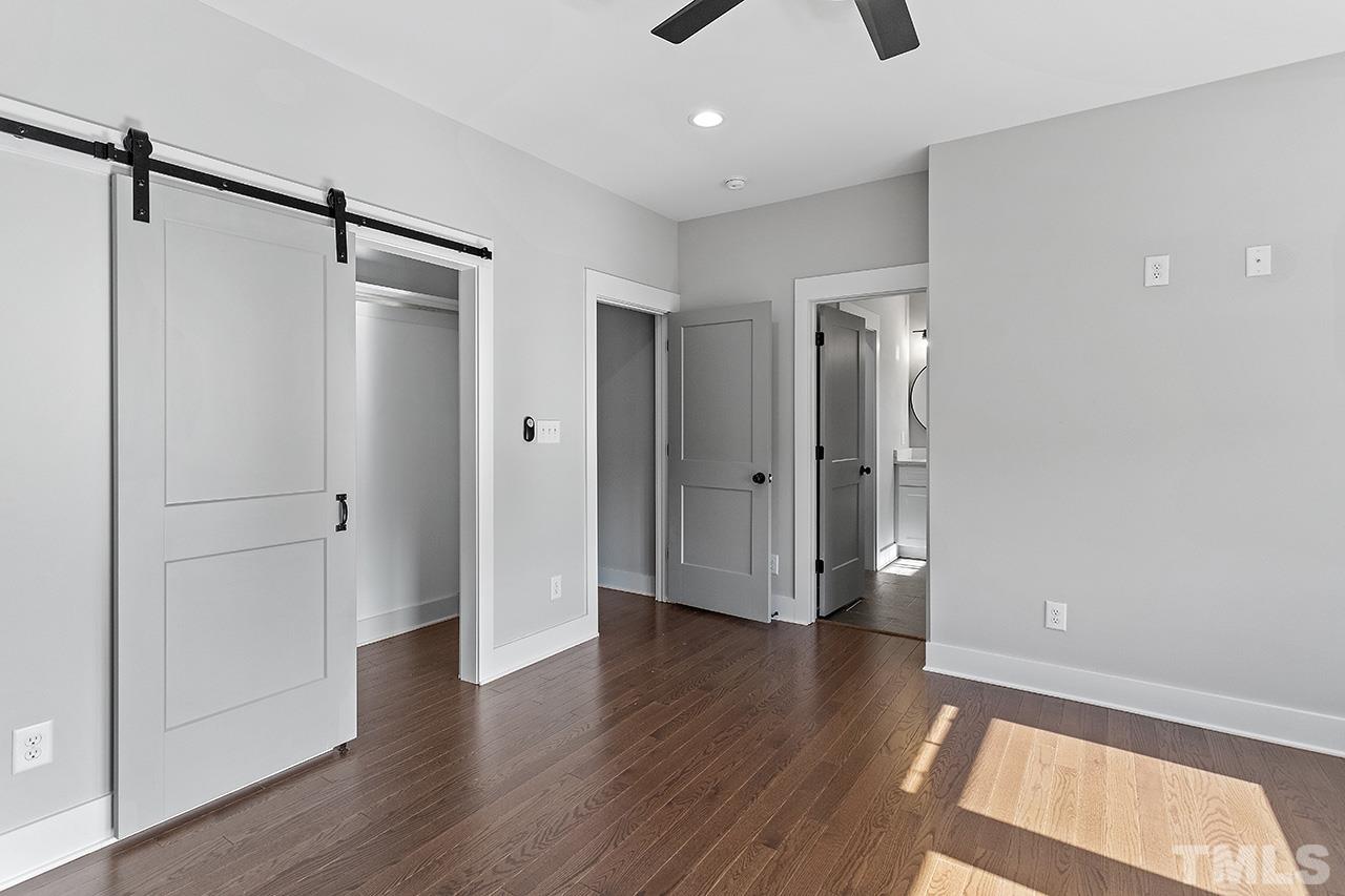 2320.5 Milburnie Road Raleigh, NC 27610 - Photo 25 of 32 a view of a hallway with wooden floor