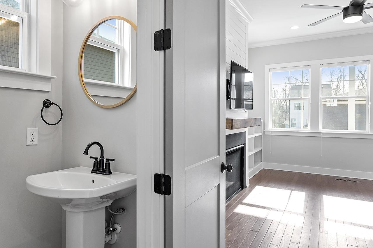 2320.5 Milburnie Road Raleigh, NC 27610 - Photo 9 of 32 a bathroom with a sink and a mirror