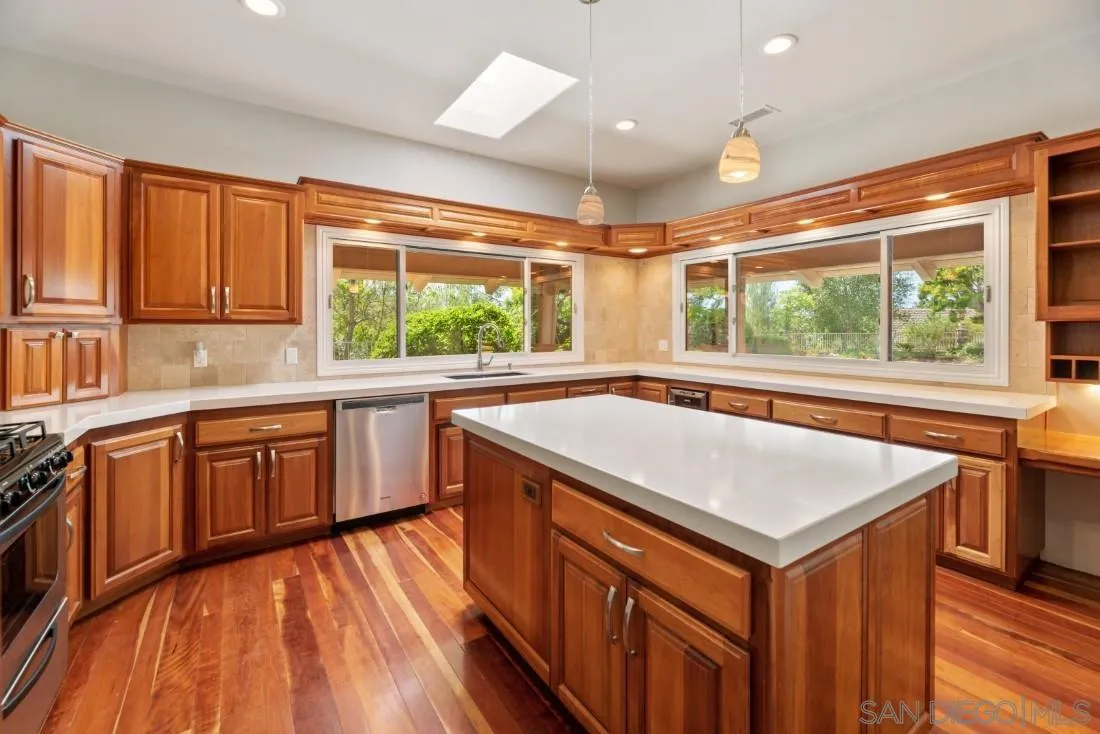 13260 Glen Circle Road Poway, CA 92064 - Photo 17 of 53 a kitchen with a stove a sink and a refrigerator